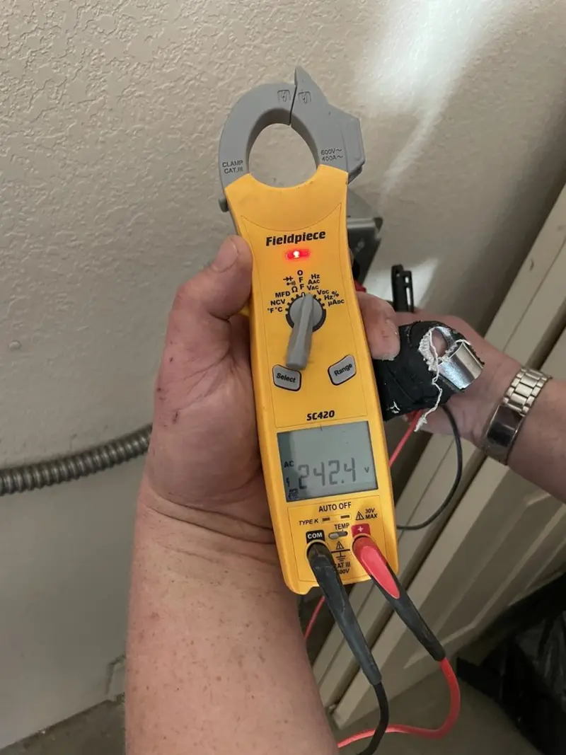 Voltage testing with clamp meter during Outlet Installation in Cutler Bay